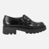 Mocasines negros de charol con adorno de hebilla y piso track