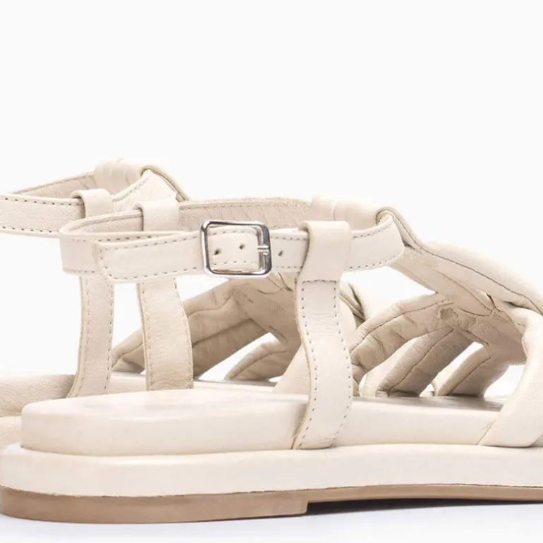 Sandalias planas de piel con tiras entrelazadas